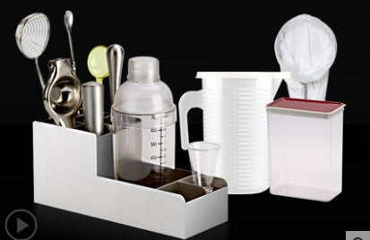 Cocktail shaker set laid out showing all 18 bar tools included